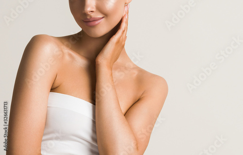 Beautiful woman  touching neck body  shoulders lips healthy skin cosmetic female