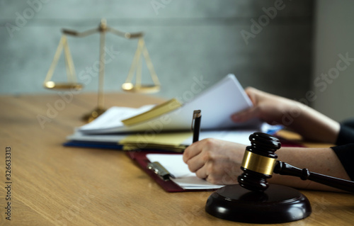 female lawyer working at the law firms. Judge gavel with scales of justice. Legal law  lawyer  advice and justice concept.