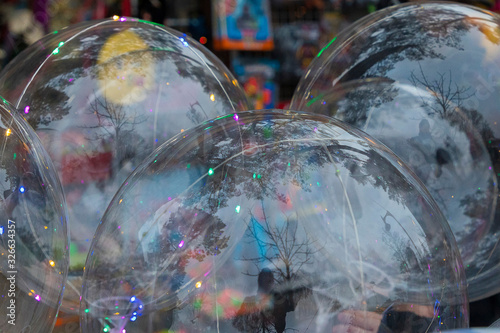 large, gleaming, colorful, transparent bubbles