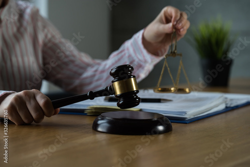 female lawyer working at the law firms. Judge gavel with scales of justice. Legal law, lawyer, advice and justice concept.