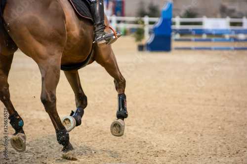 Horse running during a competition on Blurred Background