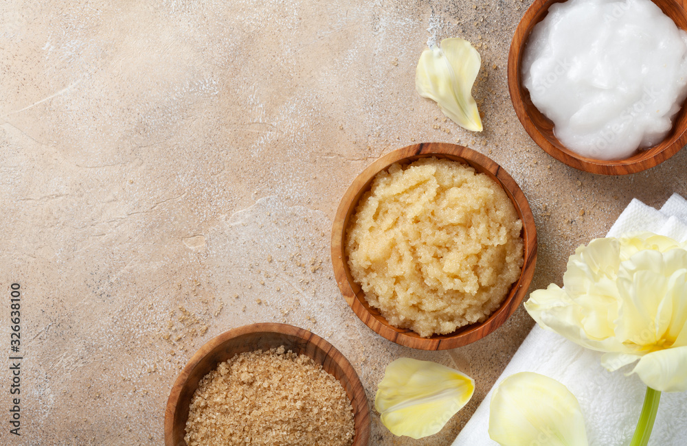 Sugar body scrub with ingredients on stone table. Homemade cosmetic for spa. Sugar body scrub with ingredients on stone table. Homemade cosmetic for spa.