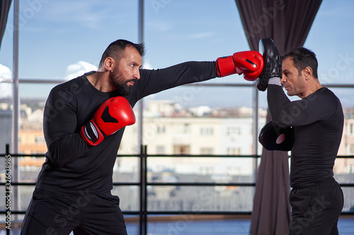 Boxer training with coach © Xalanx
