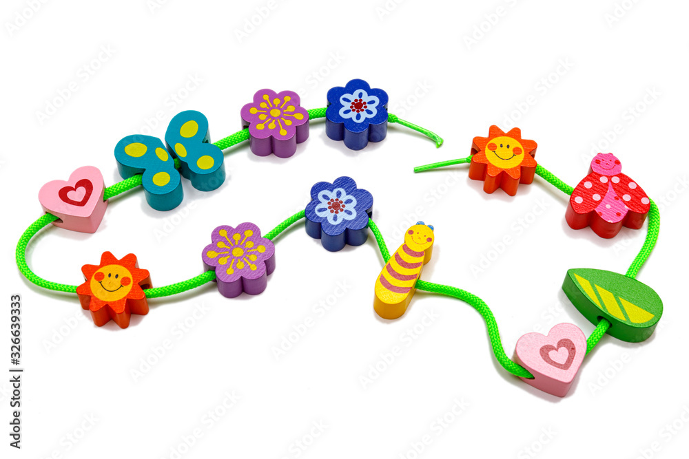 Top view with colorful wooden baby toys on isolated white background.