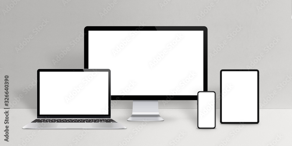 Responsive design devices mockup. Laptop, computer display, phone and tablet with isolated screen on work desk Responsive design devices mockup. Laptop, computer display, phone and tablet with isolated screen on work desk