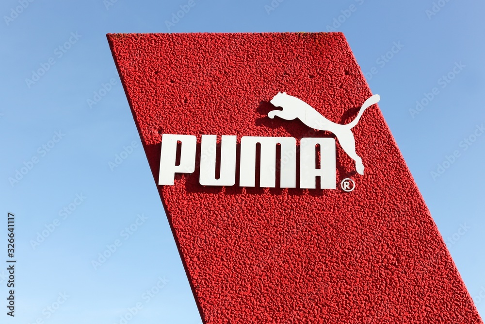 Skanderborg, Denmark - May 5, 2016: Puma logo on a wall. Puma is a major  german multinational company that produces athletic and casual footwear, as  well as sportswear Stock Photo | Adobe Stock