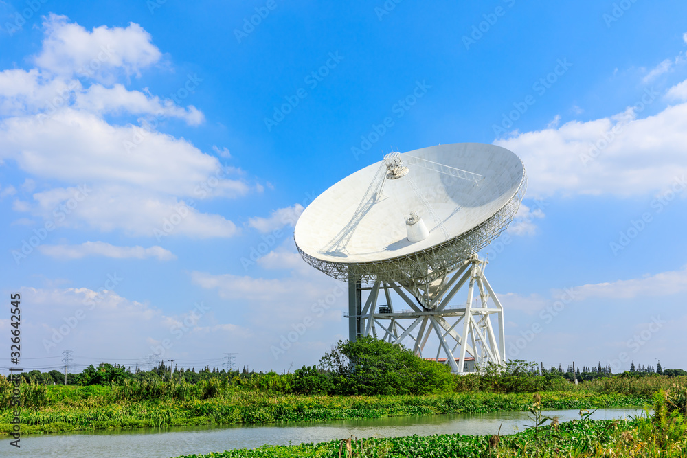 Observatory radio telescope under the blue sky in Shanghai. Observatory radio telescope under the blue sky in Shanghai.