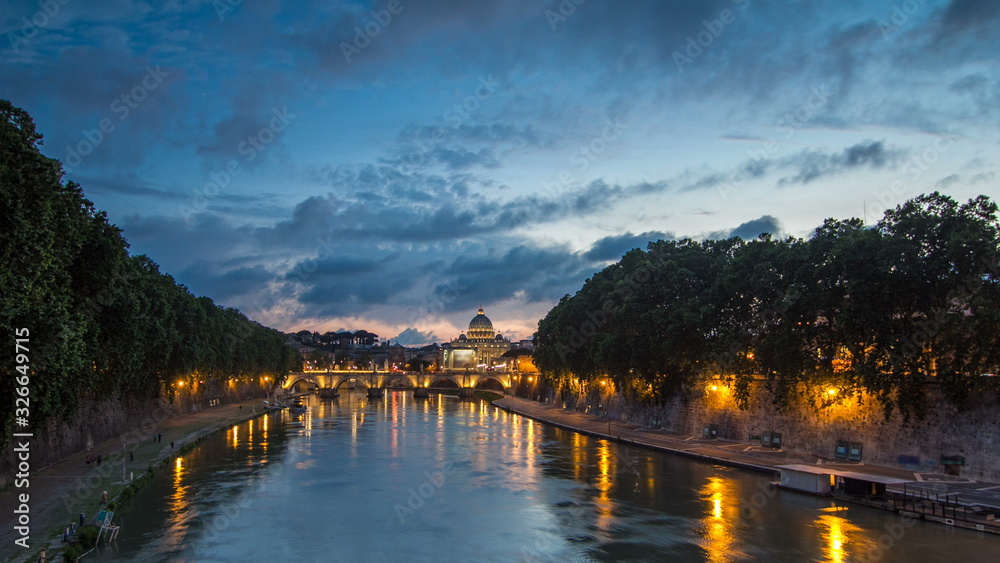 Fototapeta premium Rome, Italy: St. Peter's Basilica, Saint Angelo Bridge and Tiber River after the sunset day to night timelapse