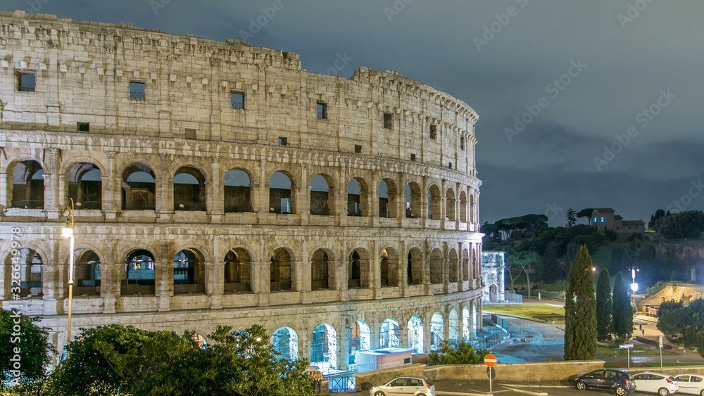 view of Colosseum illuminated at night timelapse in Rome, Italy