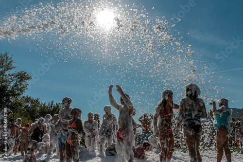 a pool party in the summer with the foam photo