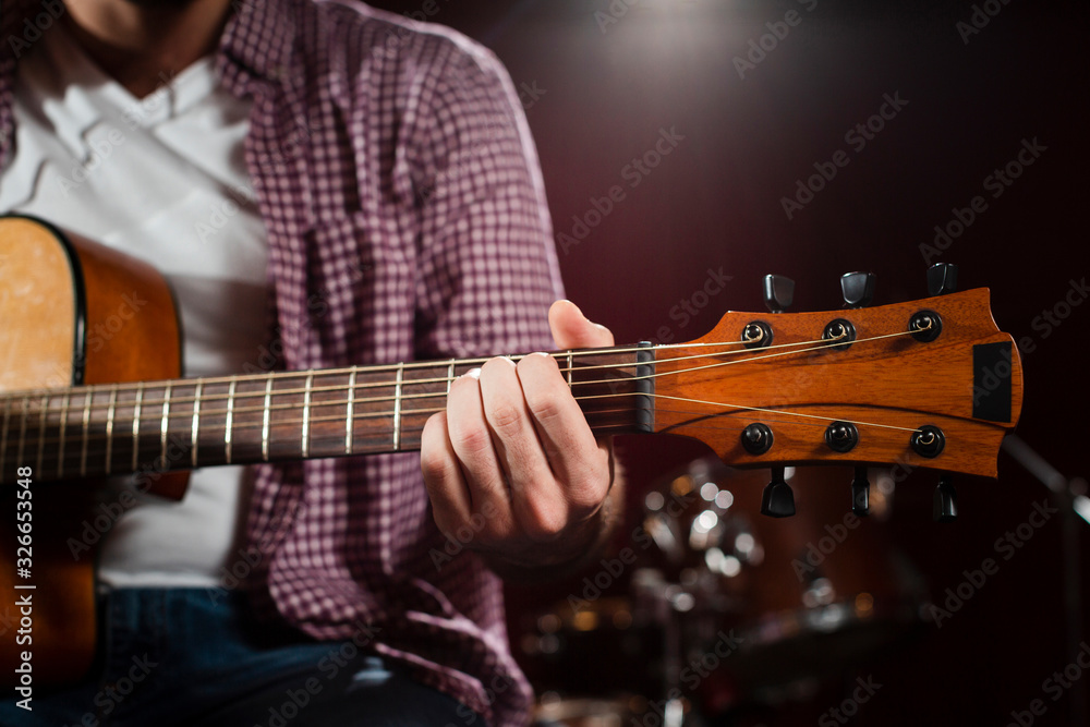 Obraz premium Close-up acoustic guitar grif with strings