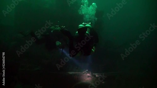 Diver on a shipwreck in Barents Sea photo