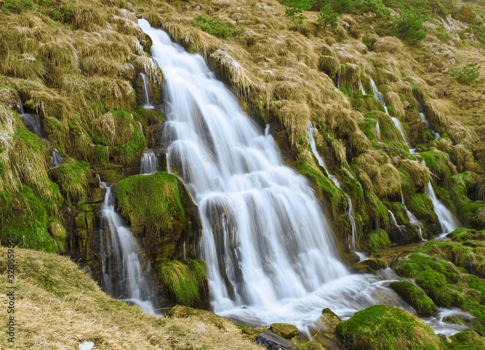 Waterfall in Puerto de Aisa, birth of the Estarrun river, Huesca, Spain Waterfall in Puerto de Aisa, birth of the Estarrun river, Huesca, Spain