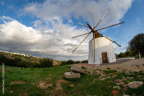 Windmill (moinho) in Albufeira Portugal, taken with a fish eye lens on a sunny day © MelissaMN