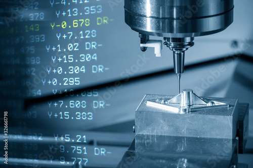 The abstract scene of CNC milling machine cutting the sample parts by long neck solid ball endmill tools . The 3 axis machining center operation and G-code data background.