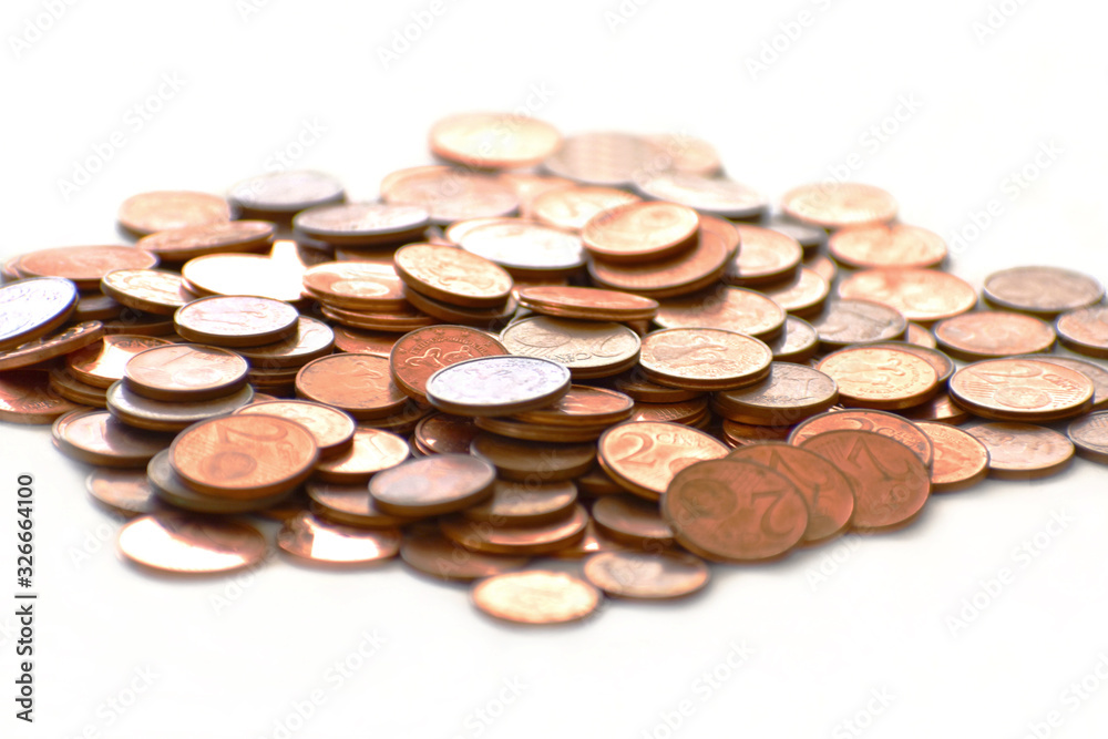 Euro cent coins on white background. Selective focus. Euro cent coins on white background. Selective focus.