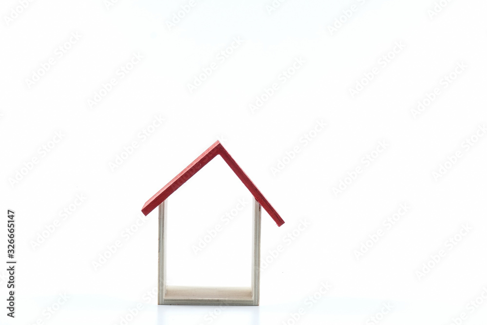 Housing/property concept with small red house isolated on white. Housing/property concept with small red house isolated on white.