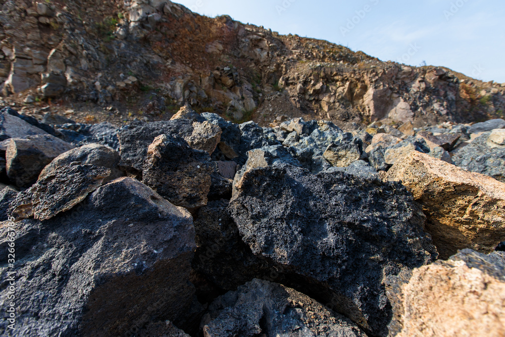 Industrial photography. Volcanic rock at the quarry. Natural stone for the manufacture of blocks and bricks
