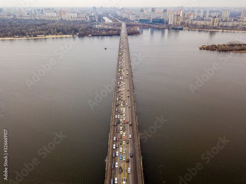 Aerial drone view. Paton road bridge across the Dnieper River. View of the left bank of Kiev. photo