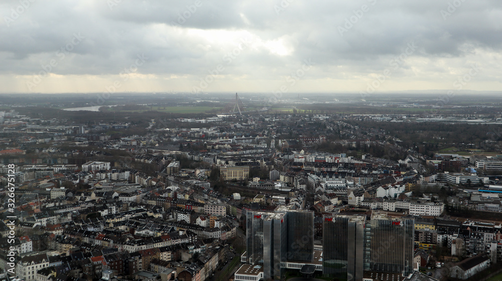 Fototapeta premium Dusseldorf, Germany - February 20, 2020. Scenic view of the city of Dusseldorf, the embankment of the river and the Rhine. Aerial view of a European city in Germany. Aerial view of a drone. Panorama.