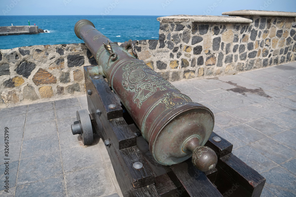 Old cannon with wheels on the coast of Tenerife island, Canary islands
