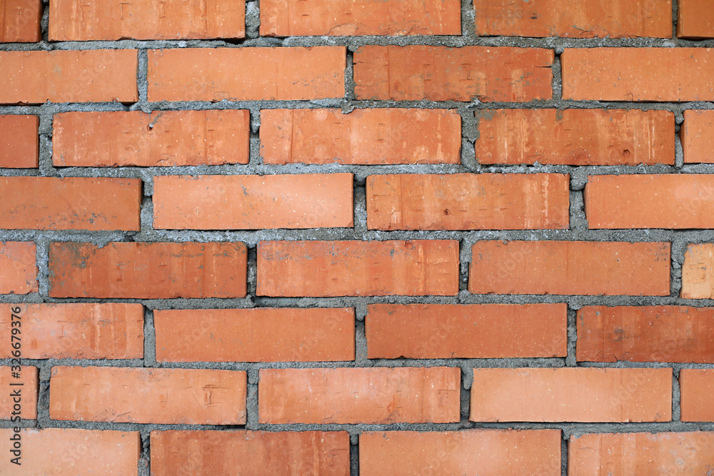 Fototapeta premium Wall made of red old fashioned bricks as background