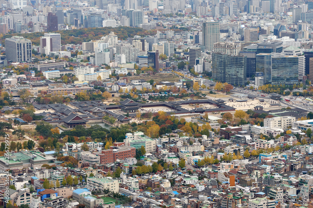 Gyeongbokgung palace in the Seoul in South Korea, aerial panoramic view from the top of Inwangsan mountain.	
