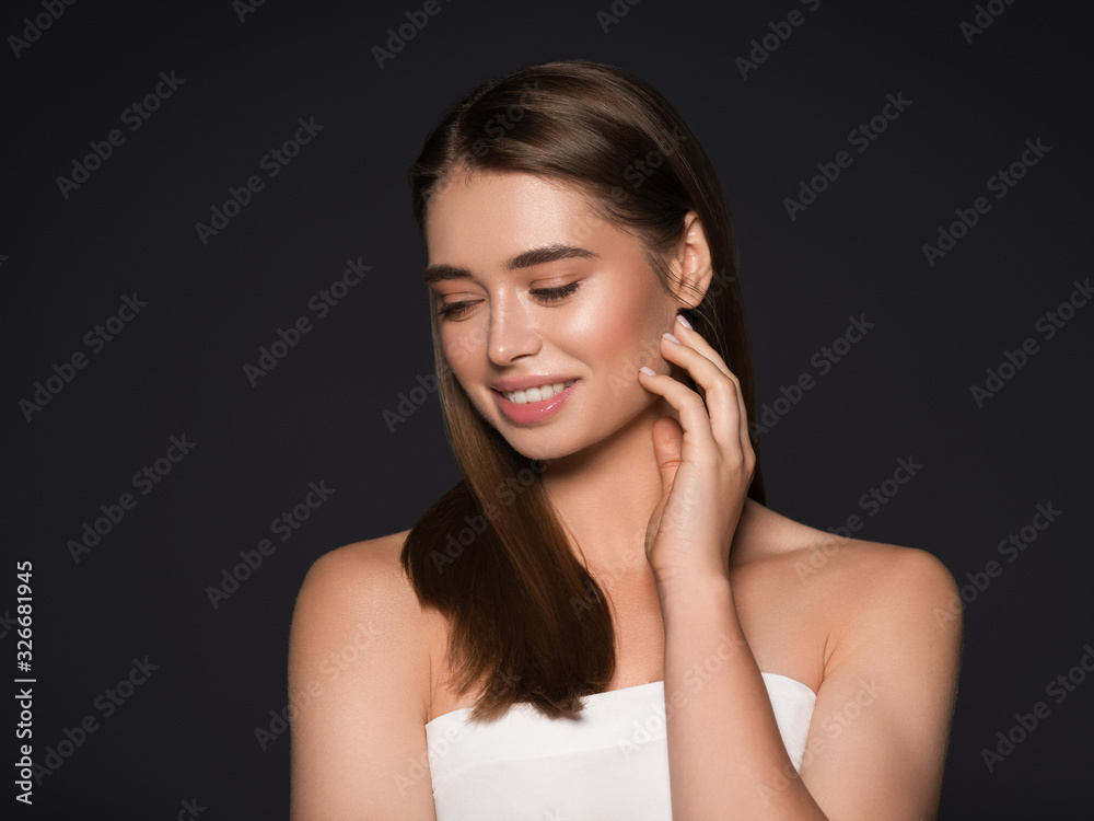 Beauty woman hand touching skin natural skin hair Studio shot of a beautiful young woman posing against a Beauty woman hand touching skin natural skin hair Studio shot of a beautiful young woman posing against a