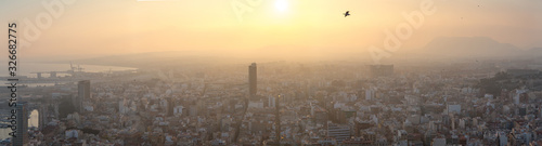 Breathtaking aerial panoramic view from Mount Benacantil of beautiful sunset over old part city of Alicante. Costa Blanca. Alicante, province of Valencia, Spain.