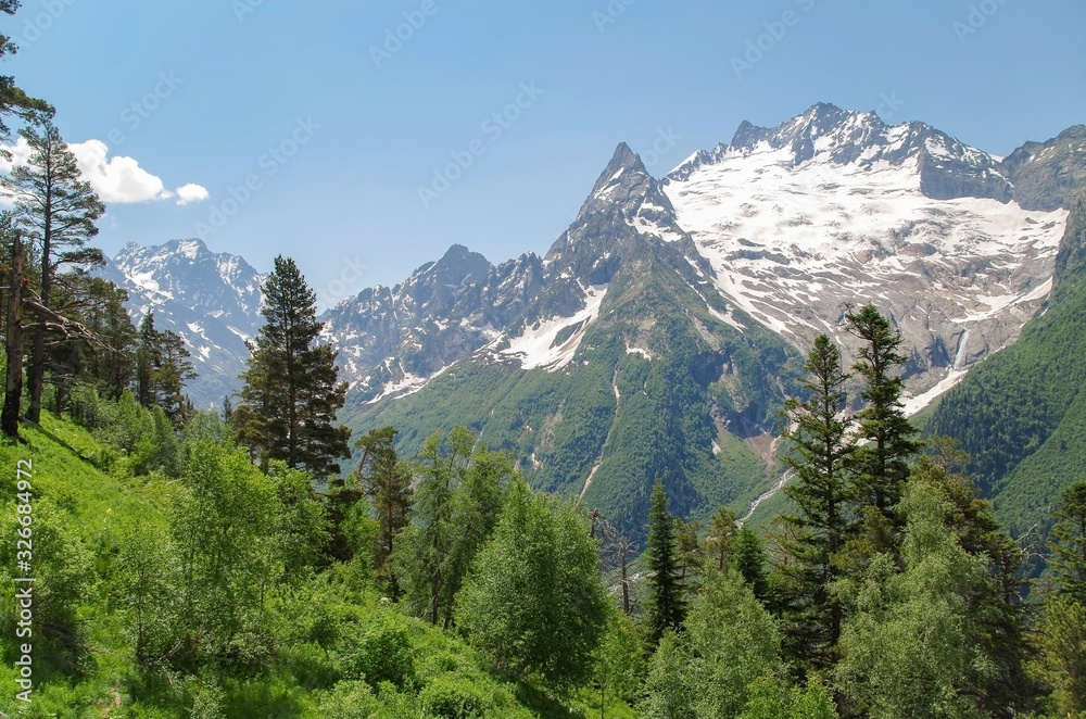 Fototapeta premium Dombay. View from the Mussa-Achitara mountain. Nature and travel. Russia, North Caucasus, Karachay-Cherkessia