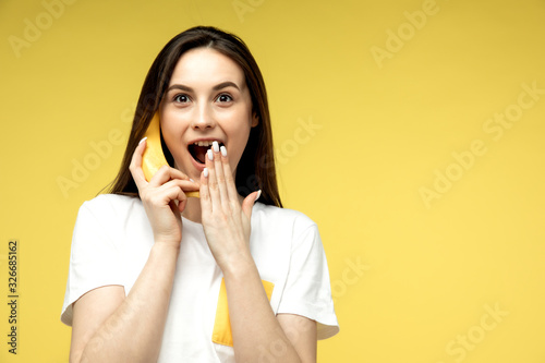 a woman making fun with a banana