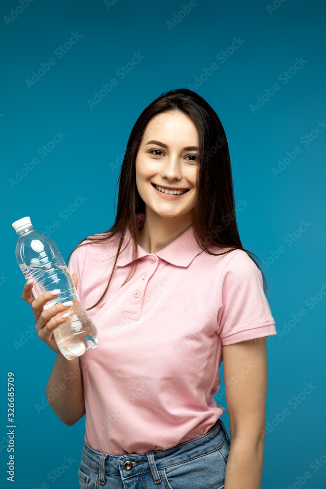 Portrait of funny emotional girl on blue background Portrait of funny emotional girl on blue background