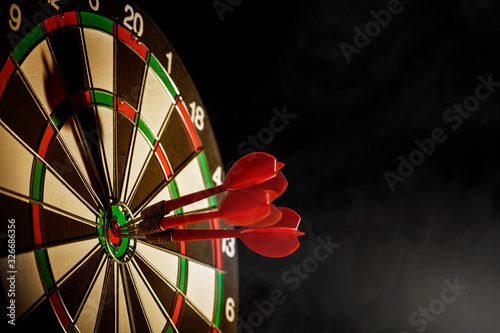 Hitting the bulls eye on the black background  photo