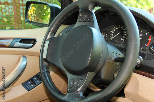 car interior steering wheel and dashboard © kristinatodoreva