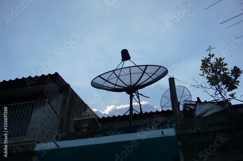 Old satellite dishes on the old roof building