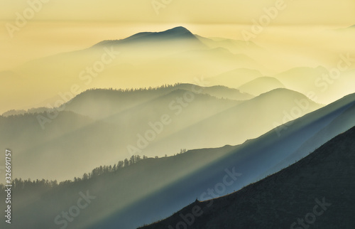 Fototapeta Naklejka Na Ścianę i Meble -  silhouettes of morning mountains. foggy morning in the Carpathians. Mountain landscape