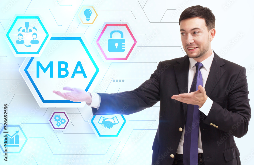 Business, Technology, Internet and network concept. Young businessman working on a virtual screen of the future and sees the inscription: MBA Business, Technology, Internet and network concept. Young businessman working on a virtual screen of the future and sees the inscription: MBA