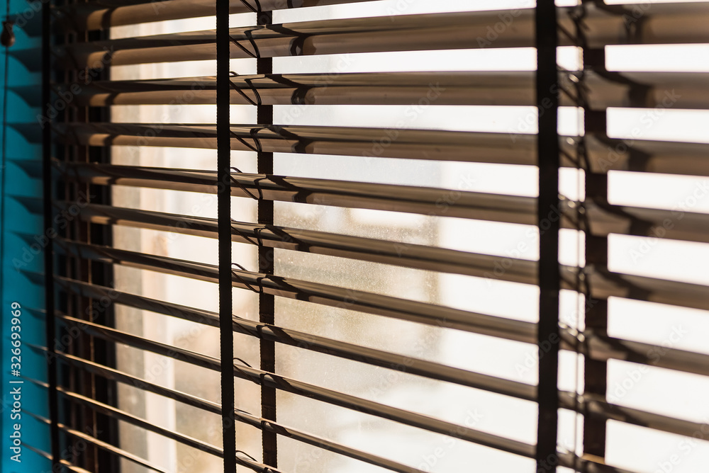 Pattern of the shutters blinds (Windows blinds) with the light sunshine Pattern of the shutters blinds (Windows blinds) with the light sunshine