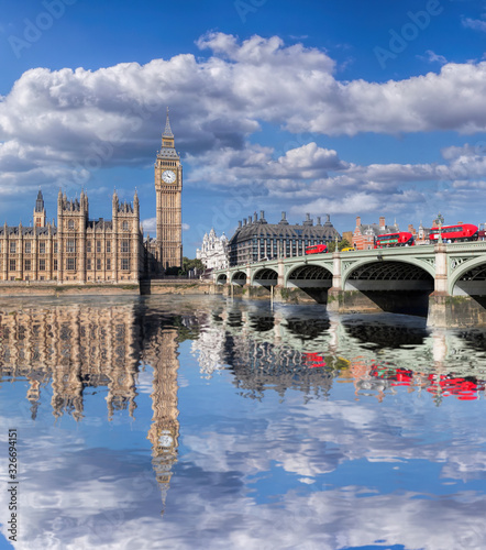 Big Ben and Houses of Parliament with red buses on the bridge in London  England  UK
