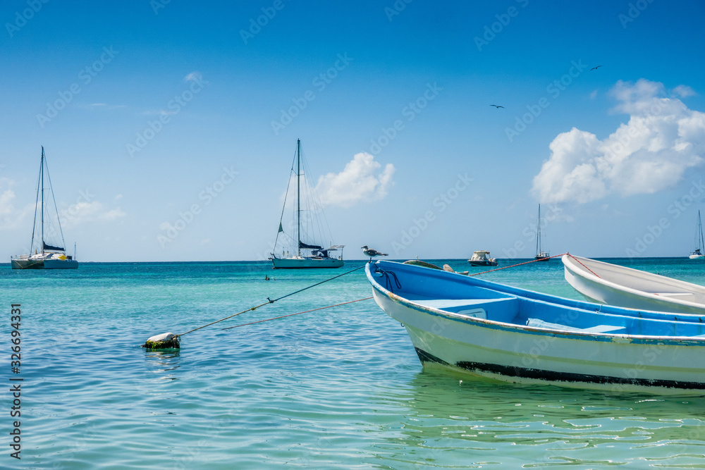 Naklejka premium Botes anchored on the beach at Los Roques National Park, Venezuela