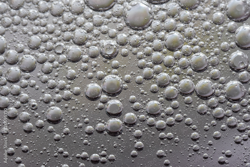 small bubbles and drops oil and water background texture gray abstraction