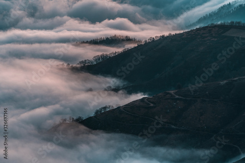Detail of the beautiful fog between the mountains of the Basque country one winter morning