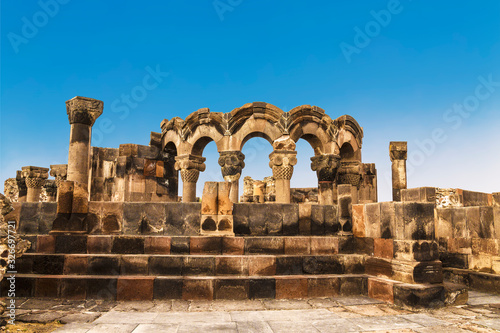 Ruins of the medieval Zvartnots temple in Armenia on a Sunny summer day against a blue sky
