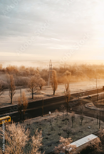 Winter landscape in fog on road. Trees, view from heights.