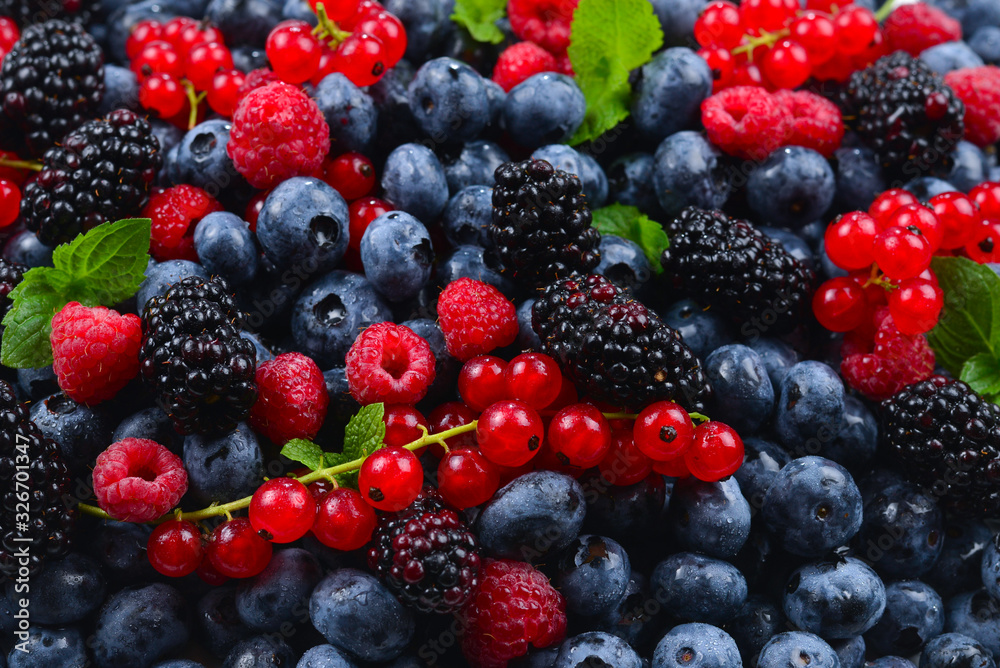 Blackberry, raspberry, blueberry, red currant and mint background. Blackberry, raspberry, blueberry, red currant and mint background.