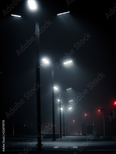 Canvas Print Modern street lights in the fog on empty parking in the night