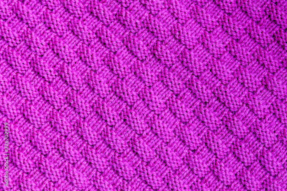 Abstract textured background of pink knitting