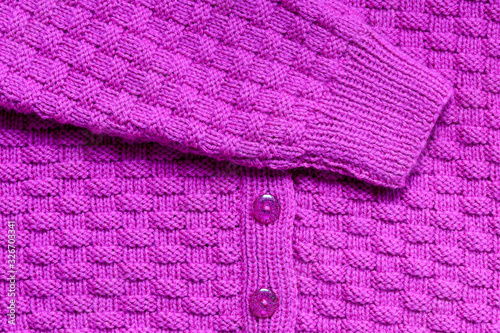 Abstract textured background of pink knitting