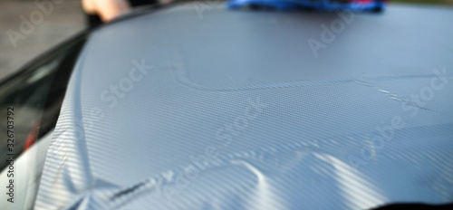 pasting a car with a carbon film. car body tuning.