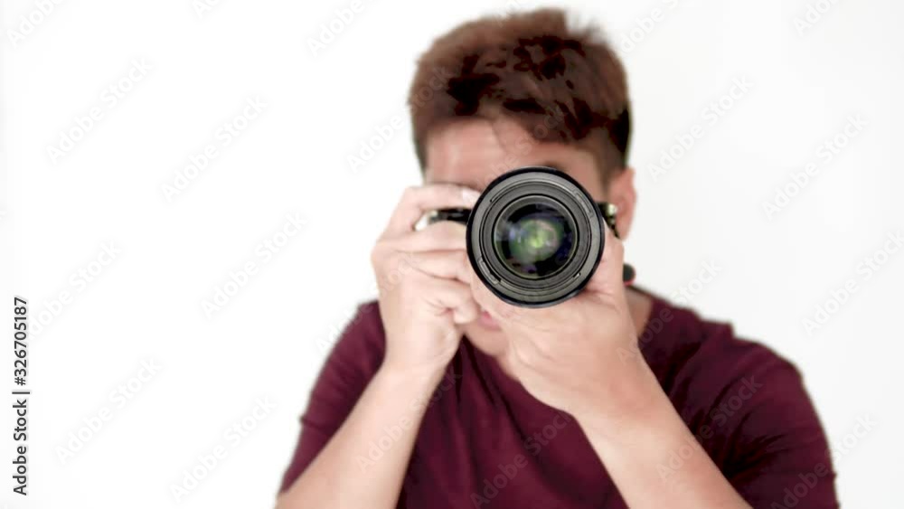 4k Asian man photographer using camera taking photo on isolate white background. 4k Asian man photographer using camera taking photo on isolate white background.